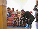 Twins with father in kindergarden.